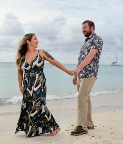 sailboat clouds beach smiles bride & husband holding hands best bridal airbrush spray tan in Indian Harbour Beach Florida