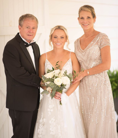 brides parents white dress Viera Florida bridal dress spray tan celebrate airbrush tans bouquet flowers tuxedo mom dad daughter